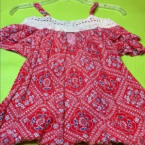 A red white and blue shoulder shirt